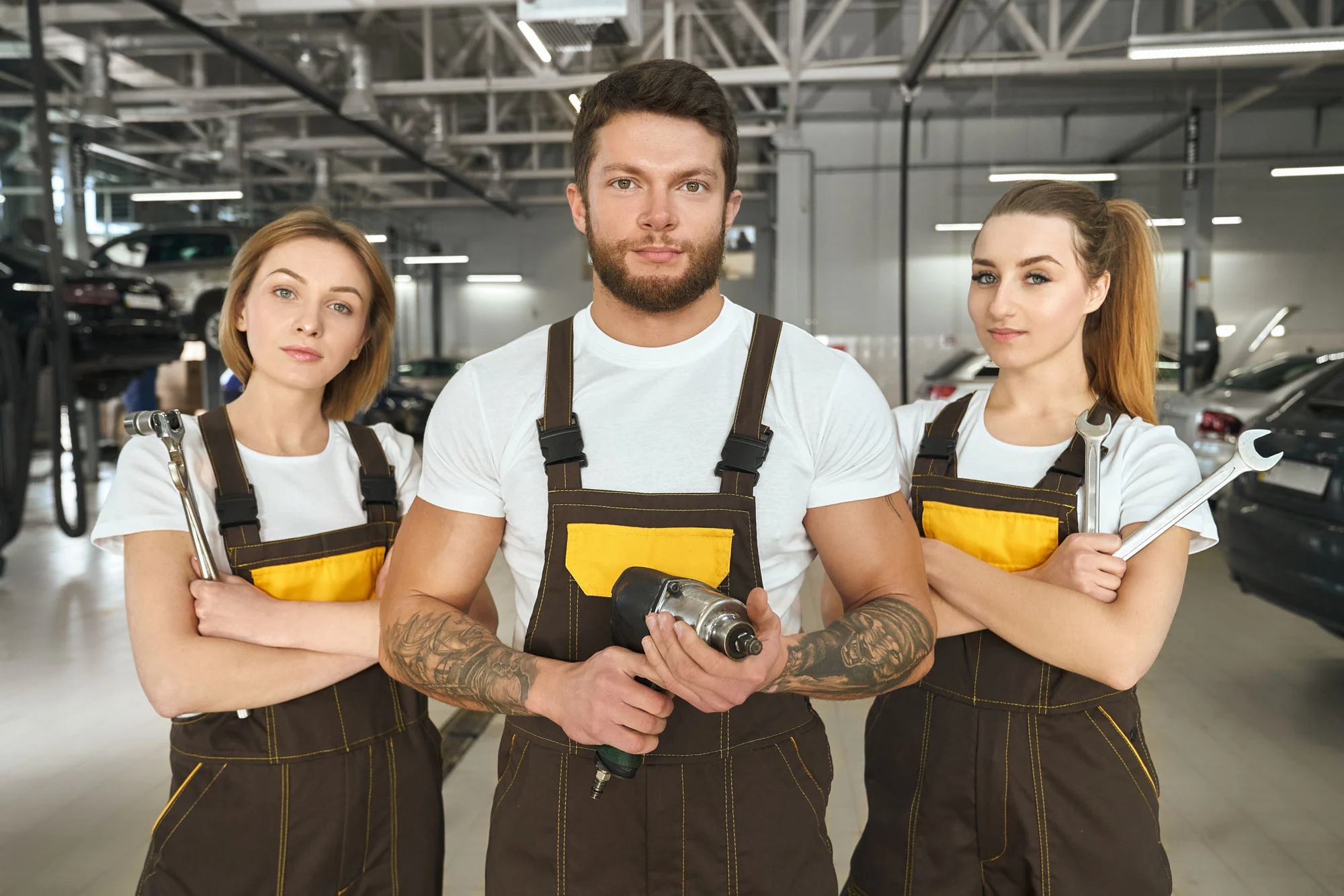 handsome-man-and-women-mechanics-of-autoservice-po-2026-01-09-07-05-14-utc2.webp